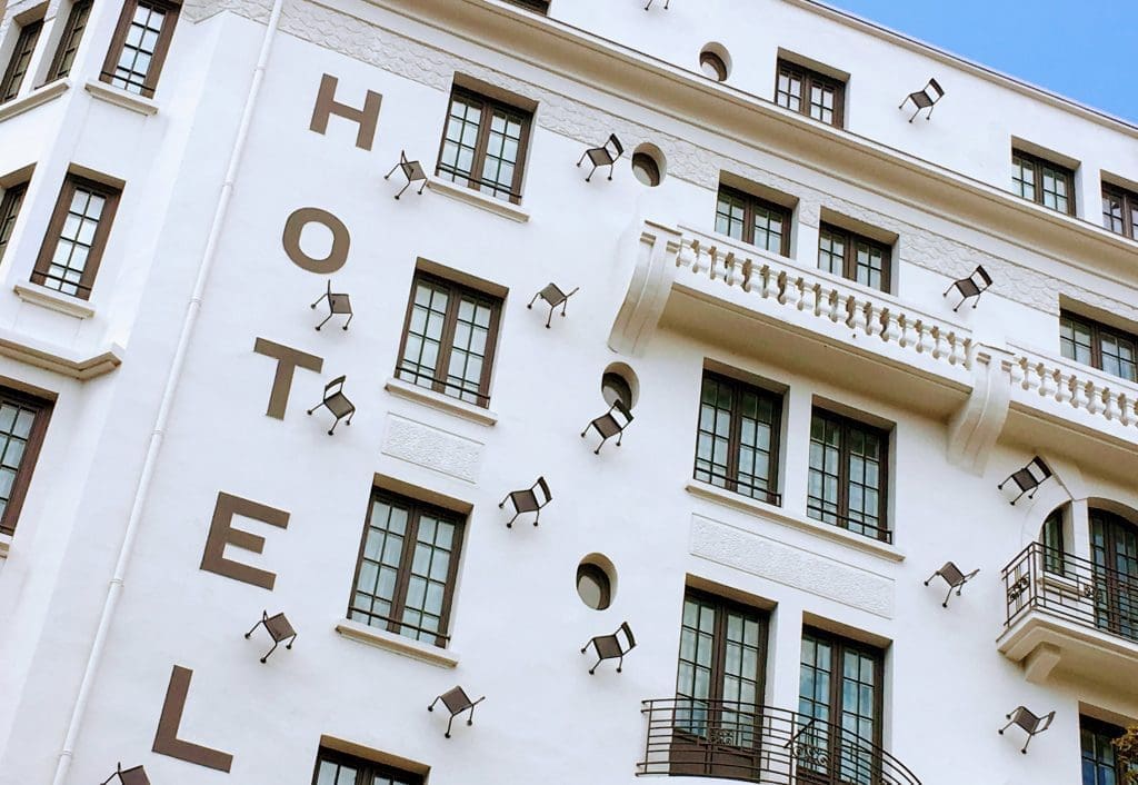 Fresque des Lyonnais | See 30 Famous People on one Lyon Mural 9 Lyon murals: chairs painted on a hotel