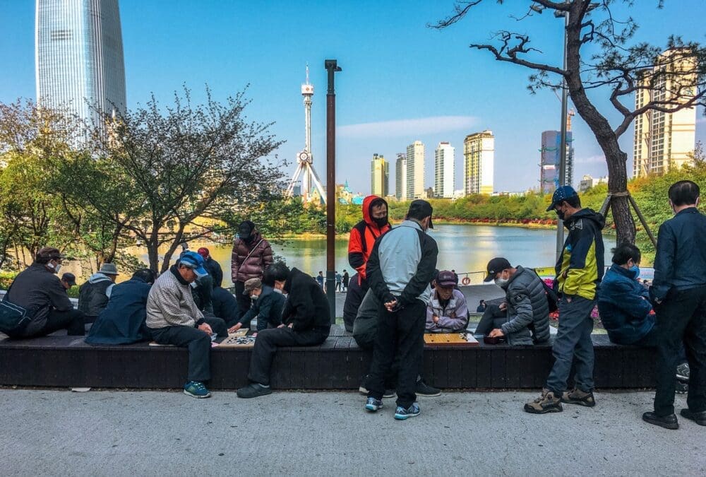 men playing baduk at seokchon lake park