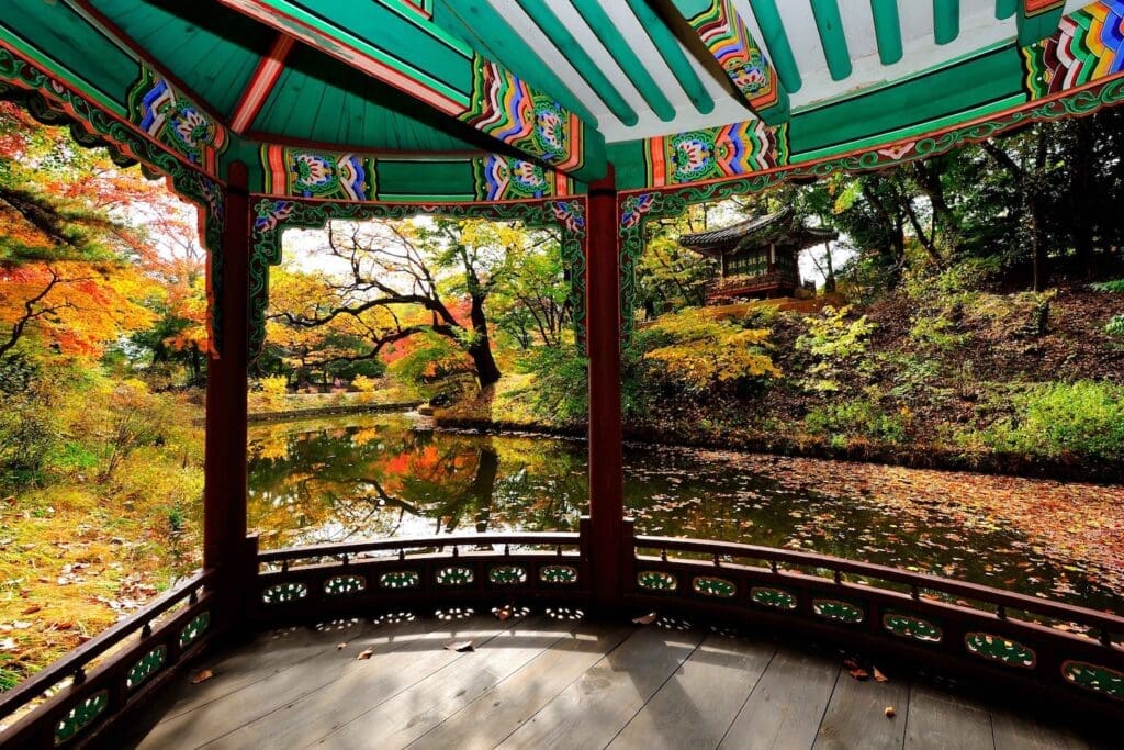 view through a pavilion at the secret garden at changdeokgung palace in autumn