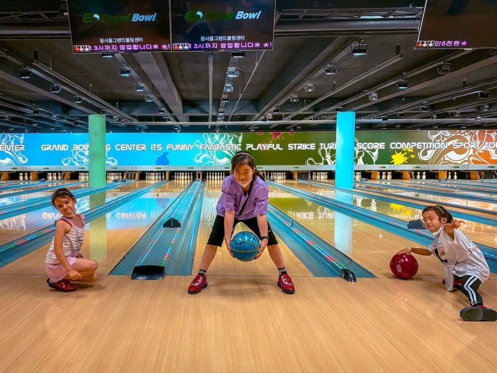 76 Delightful Things to do on a Rainy Day in Seoul (+ Heat and Pollution too!) 73 kids at a bowling alley in seoul on a rainy day
