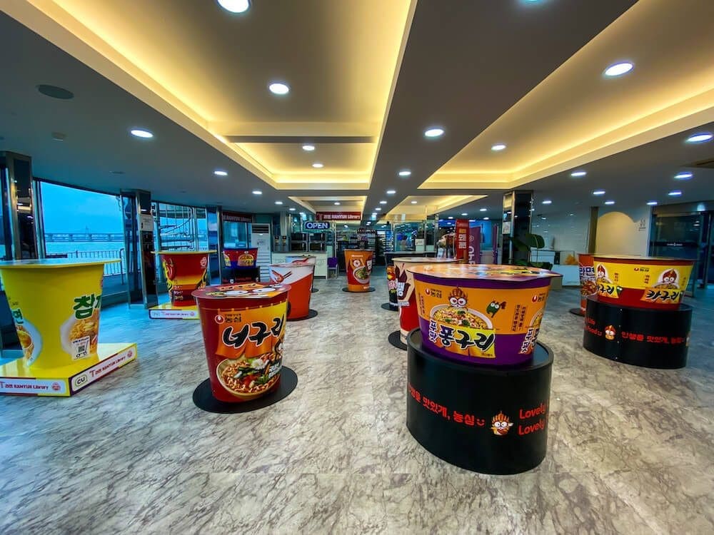 The Viral Ramyun Library in Seoul | A Noodle Novel with 225 Delicious Chapters 7 cup ramyeon tables at the ramyun library