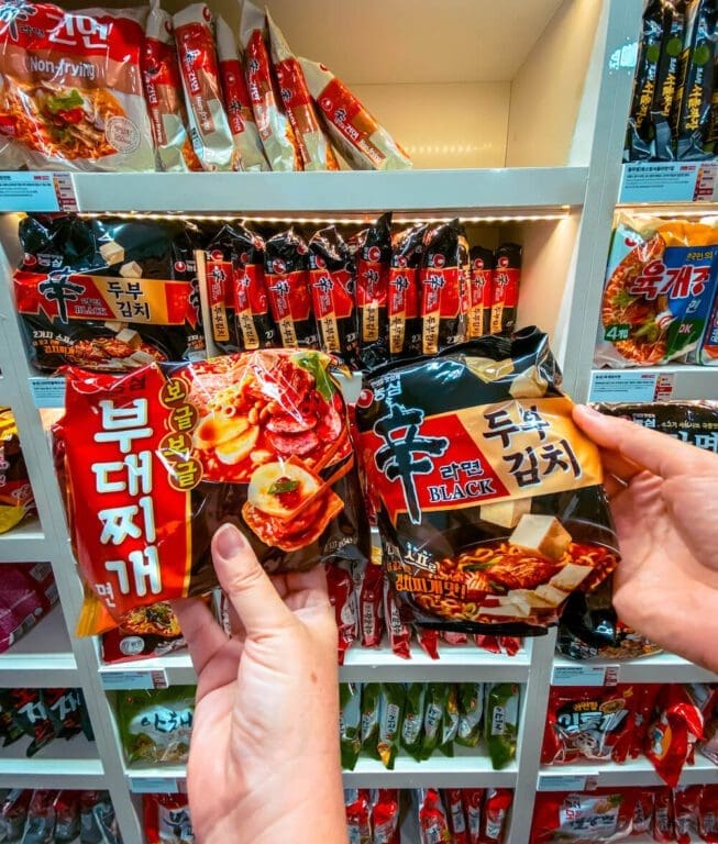Jjimjilbang 101: Beginner's Guide to Korean Saunas and Bathhouse Etiquette 17 Convenience store shelves stocked with a wide selection of spicy Korean instant ramyun noodles.