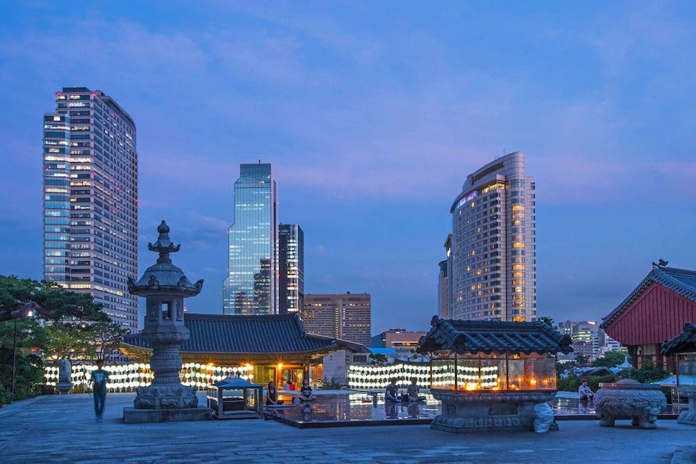 Gangnam skyscrapers behind Bongeunsa Temple at night